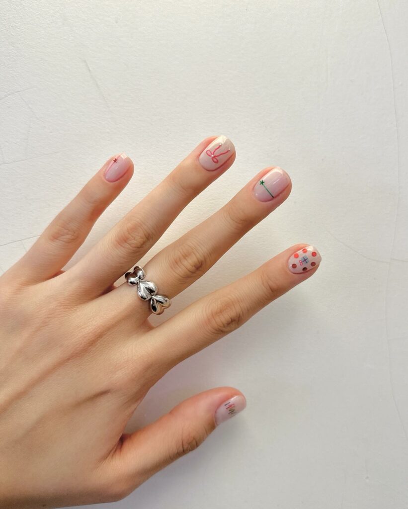 Mẫu nail tết vẽ mèo thần tài